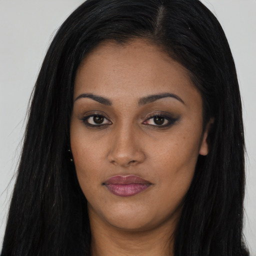 Joyful asian young-adult female with long  black hair and brown eyes