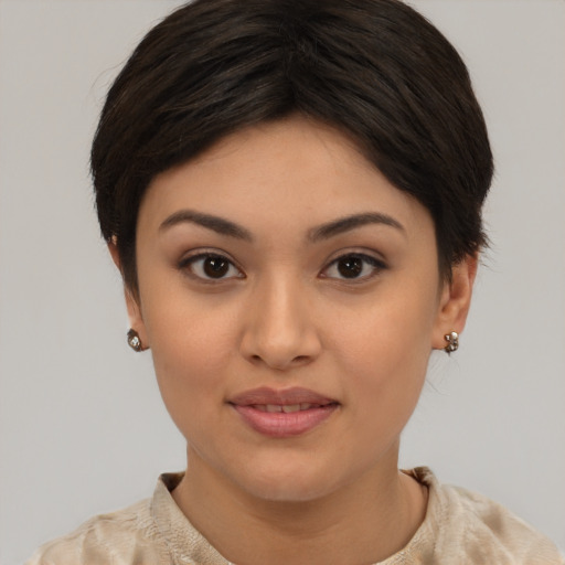 Joyful asian young-adult female with short  brown hair and brown eyes