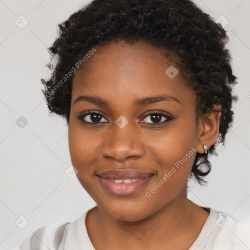 Joyful black young-adult female with medium  black hair and brown eyes