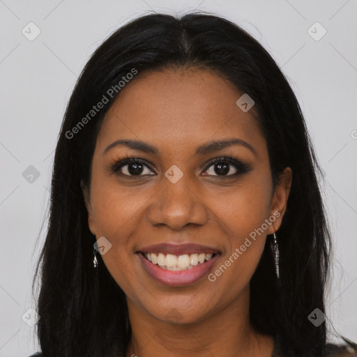 Joyful black young-adult female with long  brown hair and brown eyes