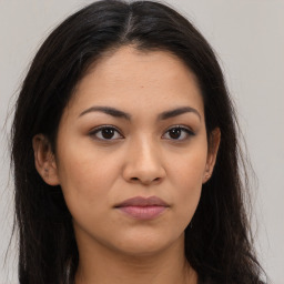 Joyful latino young-adult female with long  brown hair and brown eyes