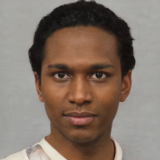 Neutral black young-adult male with short  black hair and brown eyes