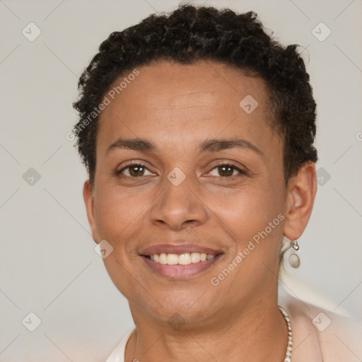 Joyful latino young-adult female with short  brown hair and brown eyes