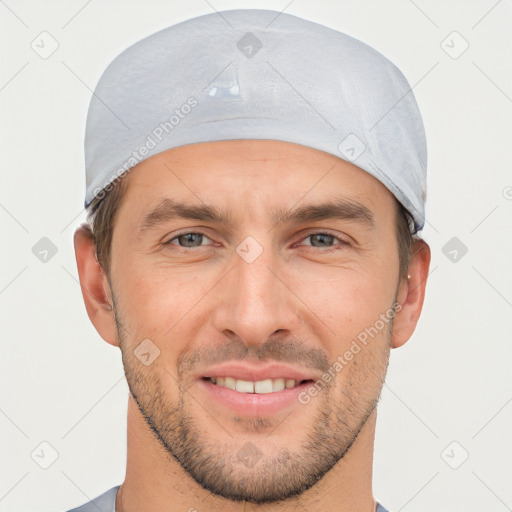 Joyful white young-adult male with short  brown hair and brown eyes