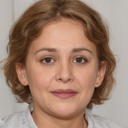 Joyful white adult female with medium  brown hair and grey eyes