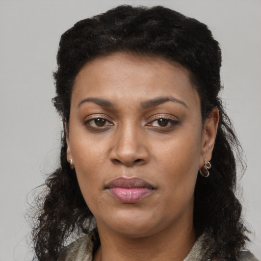 Neutral black young-adult female with long  brown hair and brown eyes