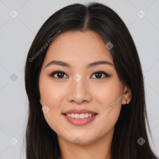 Joyful asian young-adult female with long  brown hair and brown eyes