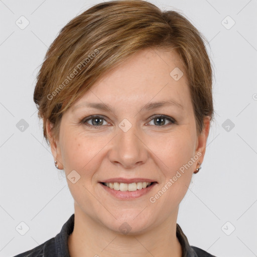 Joyful white young-adult female with medium  brown hair and grey eyes