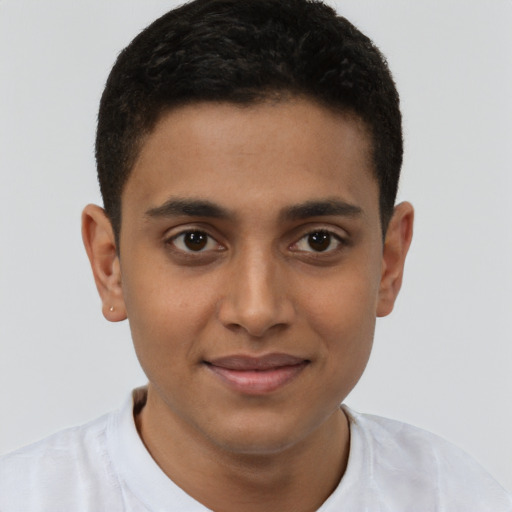 Joyful black young-adult male with short  brown hair and brown eyes