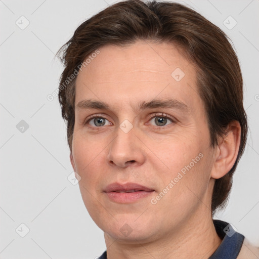 Joyful white adult male with short  brown hair and grey eyes