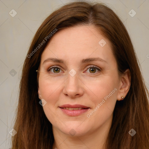 Joyful white adult female with long  brown hair and brown eyes