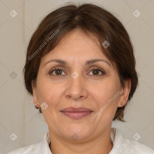 Joyful white adult female with medium  brown hair and brown eyes