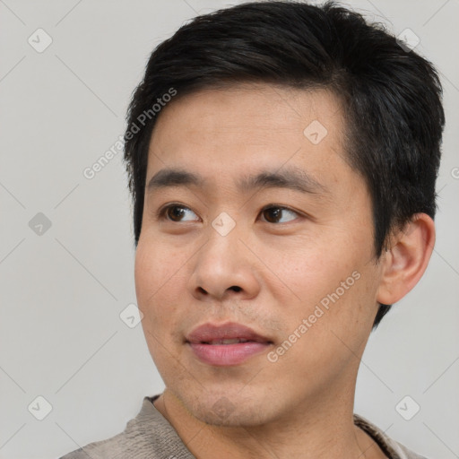 Neutral asian young-adult male with short  black hair and brown eyes