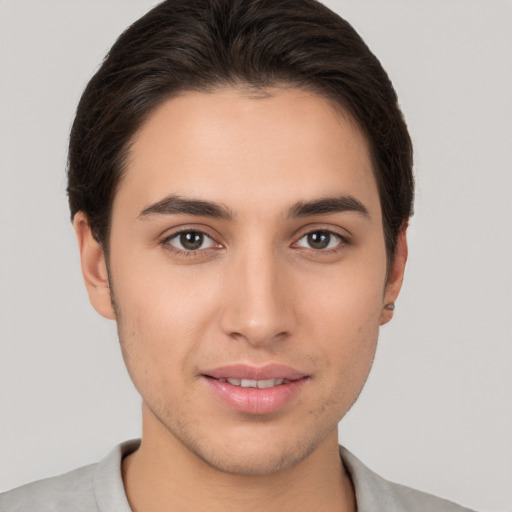 Joyful white young-adult male with short  brown hair and brown eyes