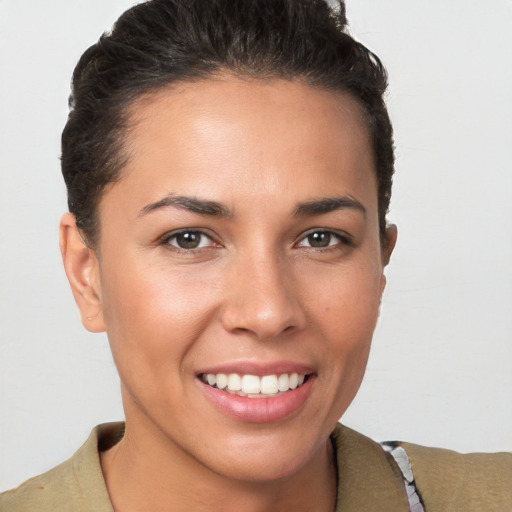 Joyful white young-adult female with short  brown hair and brown eyes