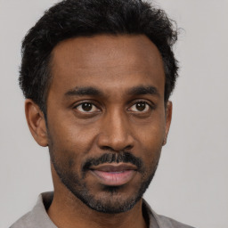 Neutral black young-adult male with short  black hair and brown eyes