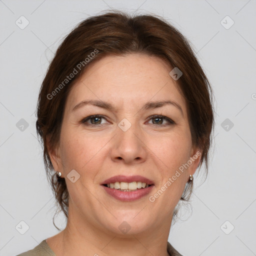 Joyful white adult female with medium  brown hair and grey eyes