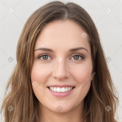 Joyful white young-adult female with long  brown hair and green eyes