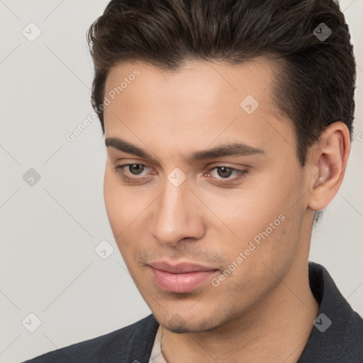 Neutral white young-adult male with short  brown hair and brown eyes