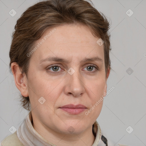 Joyful white adult female with short  brown hair and grey eyes