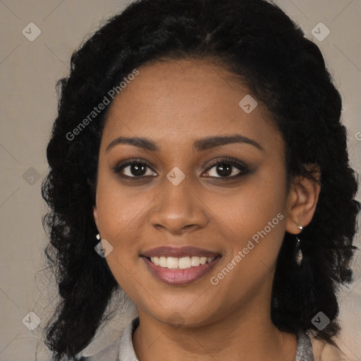 Joyful black young-adult female with long  black hair and brown eyes