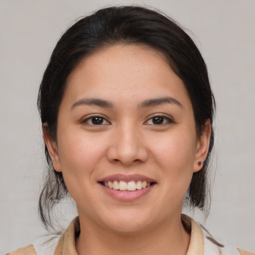 Joyful white young-adult female with medium  brown hair and brown eyes