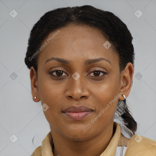Joyful black young-adult female with short  brown hair and brown eyes