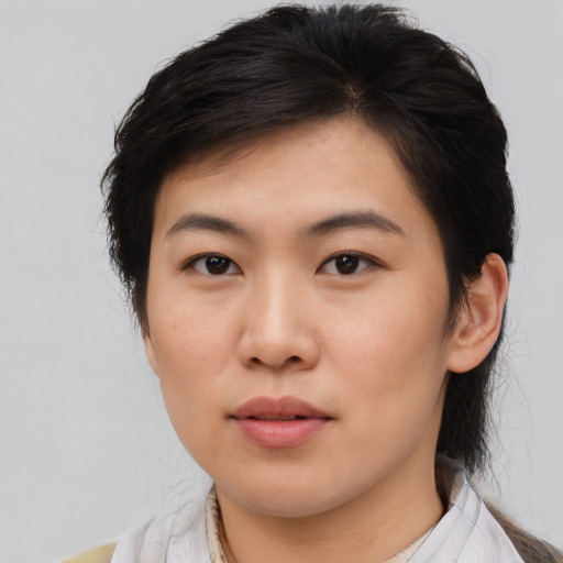Neutral asian young-adult female with medium  brown hair and brown eyes