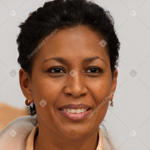 Joyful black adult female with short  brown hair and brown eyes