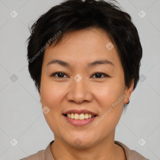 Joyful asian young-adult female with short  brown hair and brown eyes