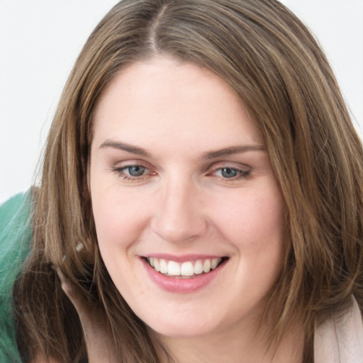 Joyful white young-adult female with long  brown hair and grey eyes