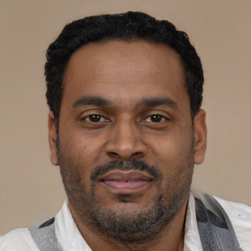 Neutral latino adult male with short  black hair and brown eyes