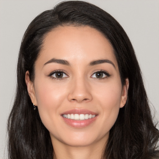 Joyful white young-adult female with long  black hair and brown eyes