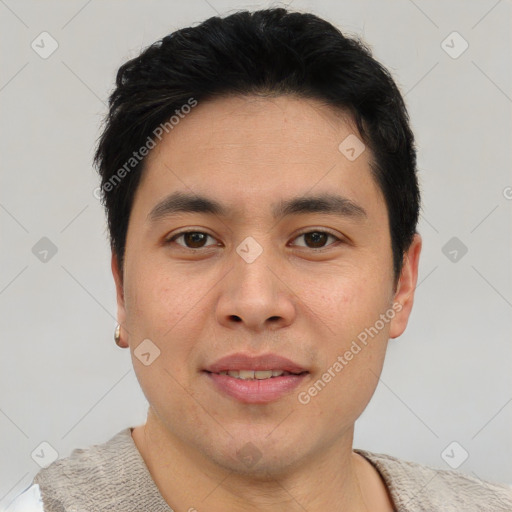 Joyful asian young-adult male with short  brown hair and brown eyes