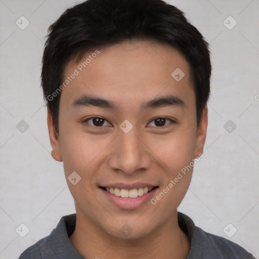 Joyful asian young-adult male with short  brown hair and brown eyes