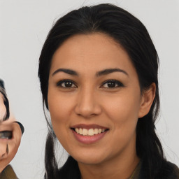 Joyful asian young-adult female with medium  black hair and brown eyes