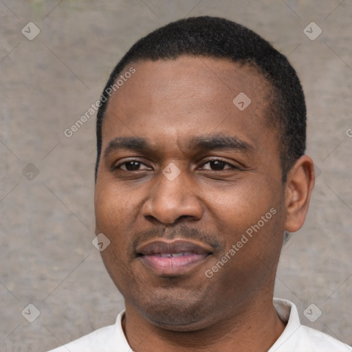 Joyful latino adult male with short  black hair and brown eyes