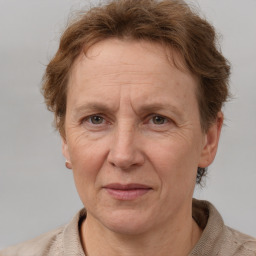 Joyful white middle-aged female with short  brown hair and brown eyes