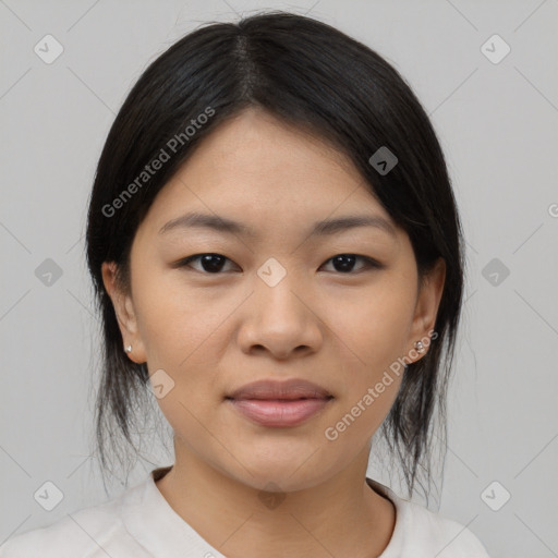 Joyful asian young-adult female with medium  black hair and brown eyes