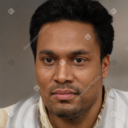 Neutral latino young-adult male with short  black hair and brown eyes