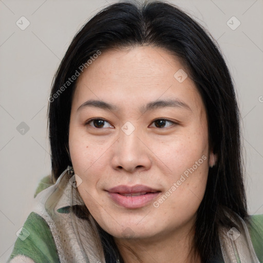 Joyful asian young-adult female with long  brown hair and brown eyes