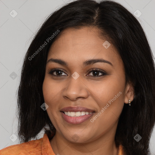 Joyful latino young-adult female with long  brown hair and brown eyes