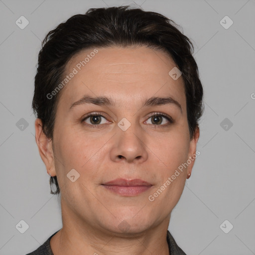 Joyful white adult female with short  brown hair and brown eyes