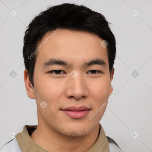 Joyful asian young-adult male with short  black hair and brown eyes