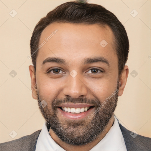 Joyful white young-adult male with short  black hair and brown eyes