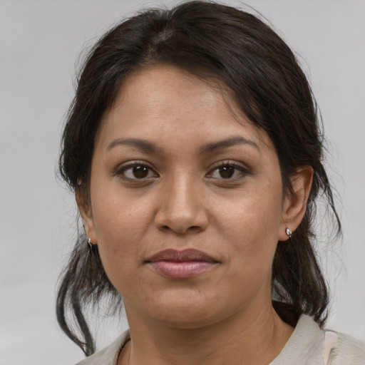 Joyful asian young-adult female with medium  brown hair and brown eyes
