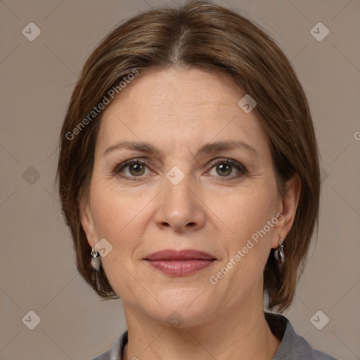 Joyful white adult female with medium  brown hair and grey eyes