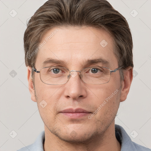 Joyful white adult male with short  brown hair and grey eyes