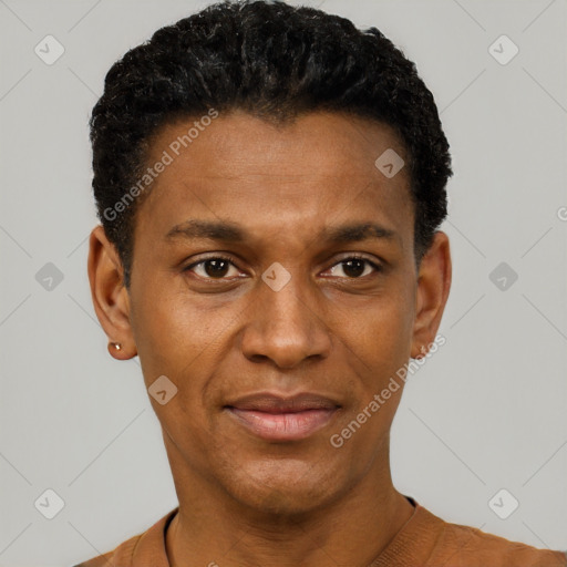 Joyful black young-adult male with short  black hair and brown eyes