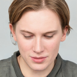 Joyful white young-adult female with long  brown hair and blue eyes